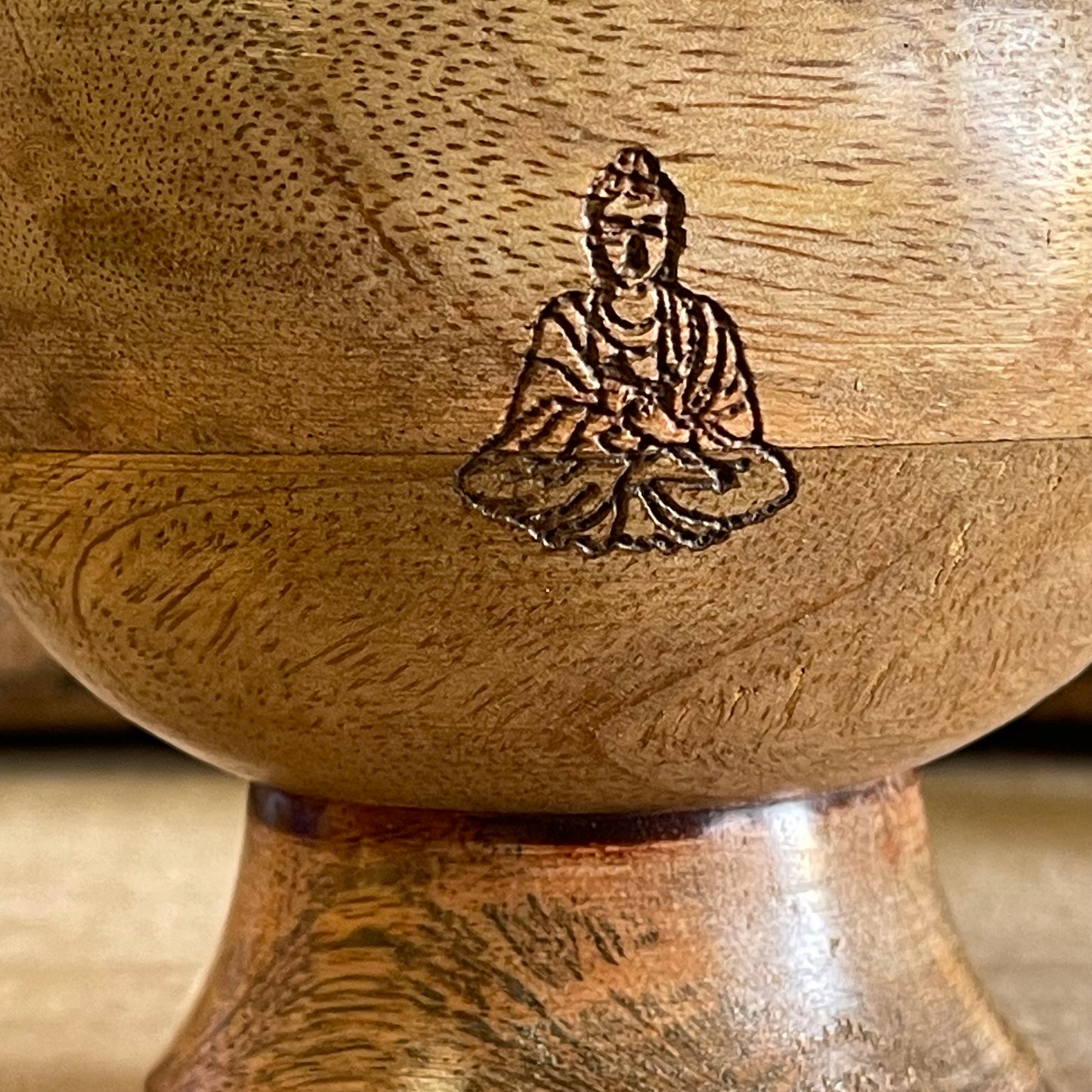 This incense holder is a compact yet intricate piece, measuring 11 cm across and standing 10 cm tall. Its dual-purpose design accommodates both incense sticks and cones, making it versatile for different types of incense rituals. The bowl-shaped holder features a serene Buddha symbol etched with precision on the inside surface, creating a focal point that enhances its spiritual ambiance. The Buddha engraving adds an element of tranquility, inviting a reflective, meditative quality to the space. Ideal for al