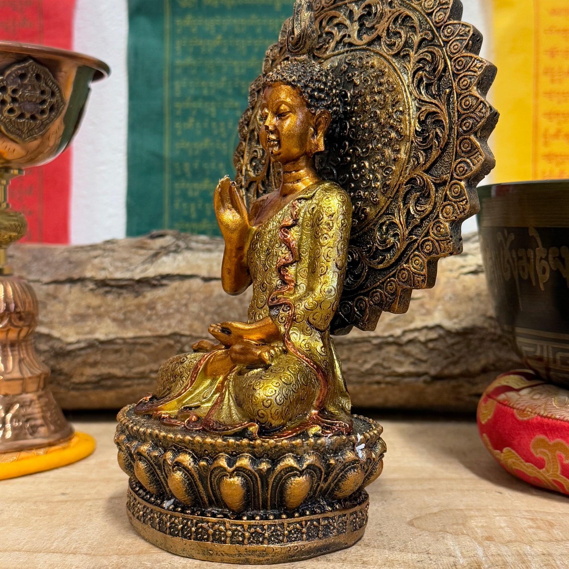 Buddha of Reassurance with Abhaya Mudra – 8cm x 18.5cm

Invite peace and protection into your home with this beautifully detailed Buddha of Reassurance statue, featuring the sacred Abhaya Mudra. Standing at approximately 18.5cm tall and 8cm wide, this exquisite statue captures the Buddha in a gesture of safety, peace, and reassurance. The Abhaya Mudra, where the right hand is raised with the palm facing outward, symbolizes protection, dispelling fear, and offering comfort during times of uncertainty.