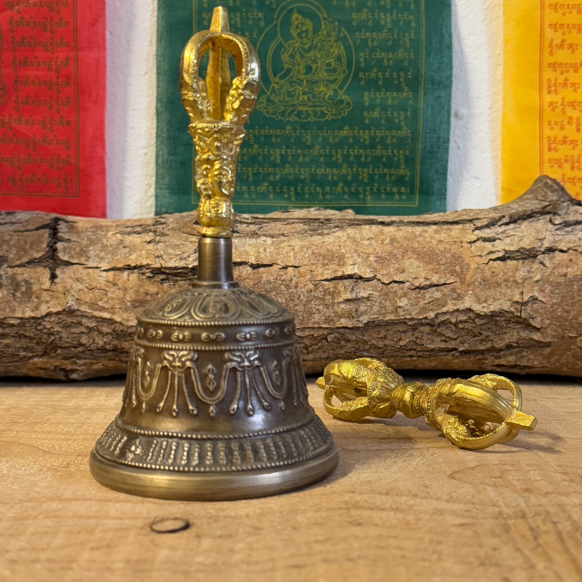 Discover the intricately engraved Kirtimukha Bell and Dorje Set, a primary ritual tool in Tibetan Buddhism. Handcrafted in Nepal, this bronze and brass set symbolizes wisdom and compassion, perfect for rituals and meditation.