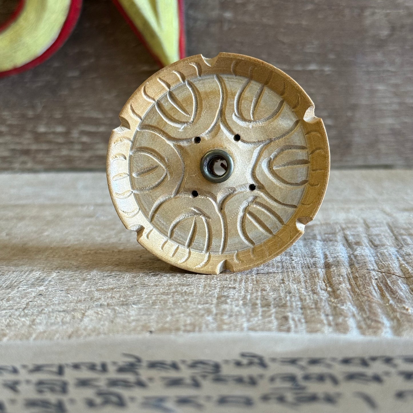 This beloved Lotus Tibetan Incense Holder is a simple yet sacred companion for your incense practice. Hand-carved from a single piece of soft yellow wood in Nepal, each piece carries the gentle energy of mindful craftsmanship and Buddhist symbolism.

The lotus, carved into its form, is a profound symbol of spiritual awakening — rising from the mud to bloom in stillness and clarity. Its wide, rounded base is designed to safely catch falling ash, making it both beautiful and practical.