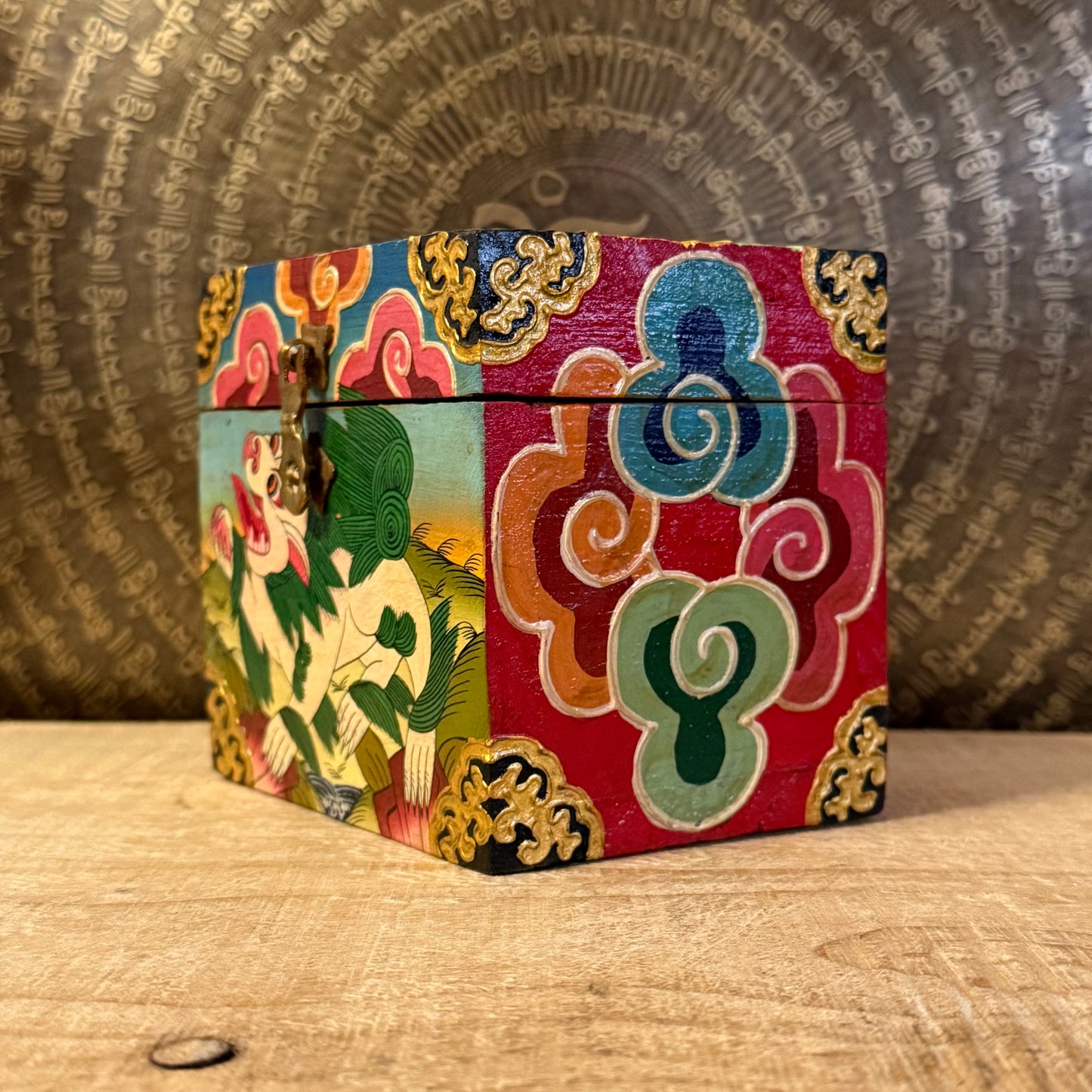 Hand-painted Tibetan square wooden box from Nepal, decorated with Buddhist symbols. Fairtrade, unique storage for jewellery or altar items.