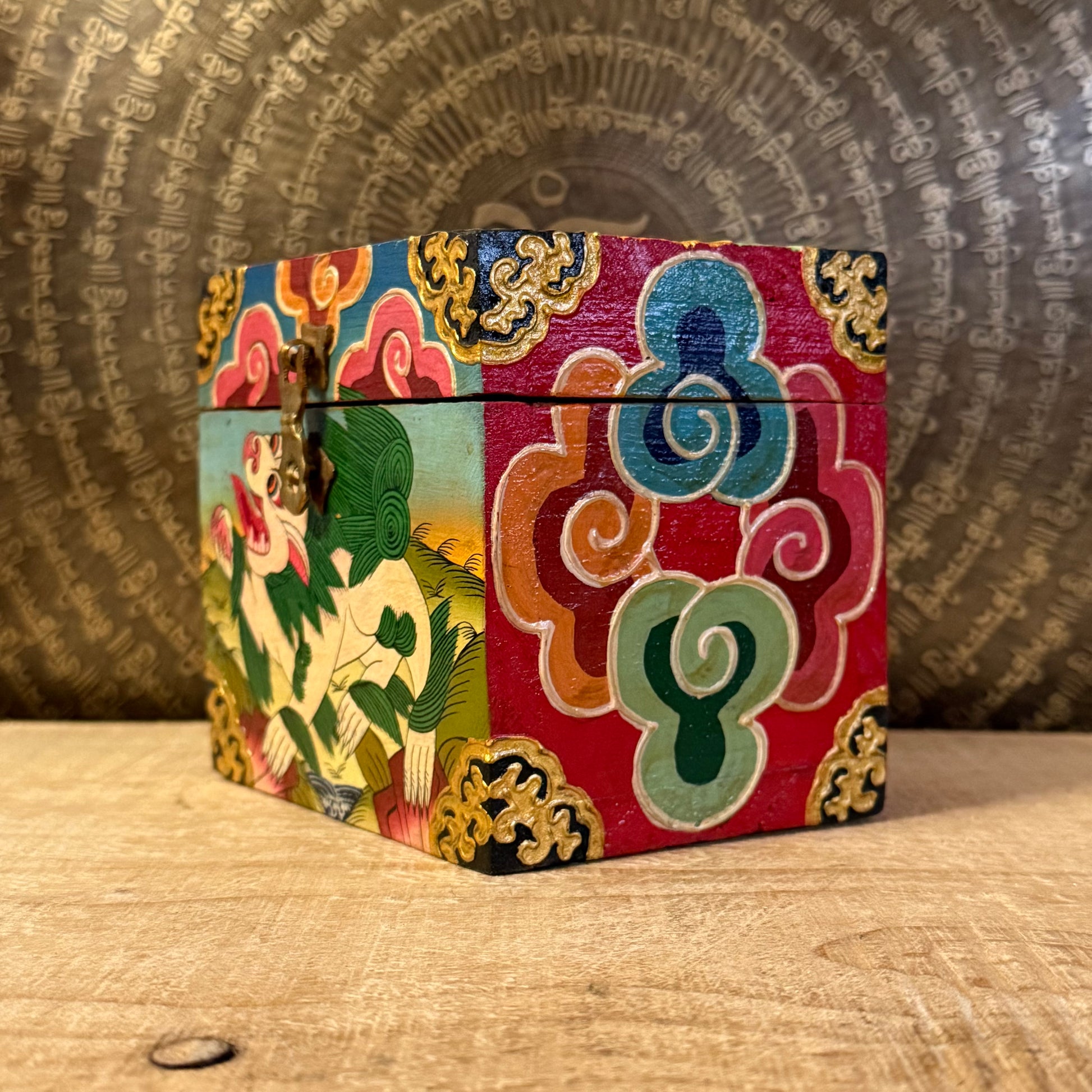 Hand-painted Tibetan square wooden box from Nepal, decorated with Buddhist symbols. Fairtrade, unique storage for jewellery or altar items.
