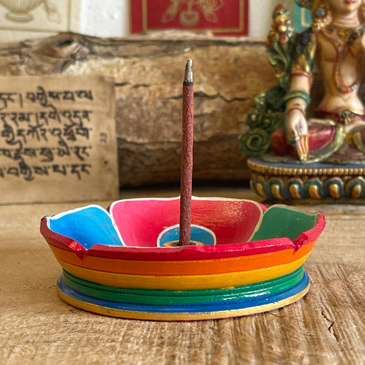 A beautiful Hand painted Tibetan Incense stick holder , Hand painted and ethically sourced this incense Holder is Perfect for the Larger Tibetan Incense it also has 4 small holes for Indian sticks.