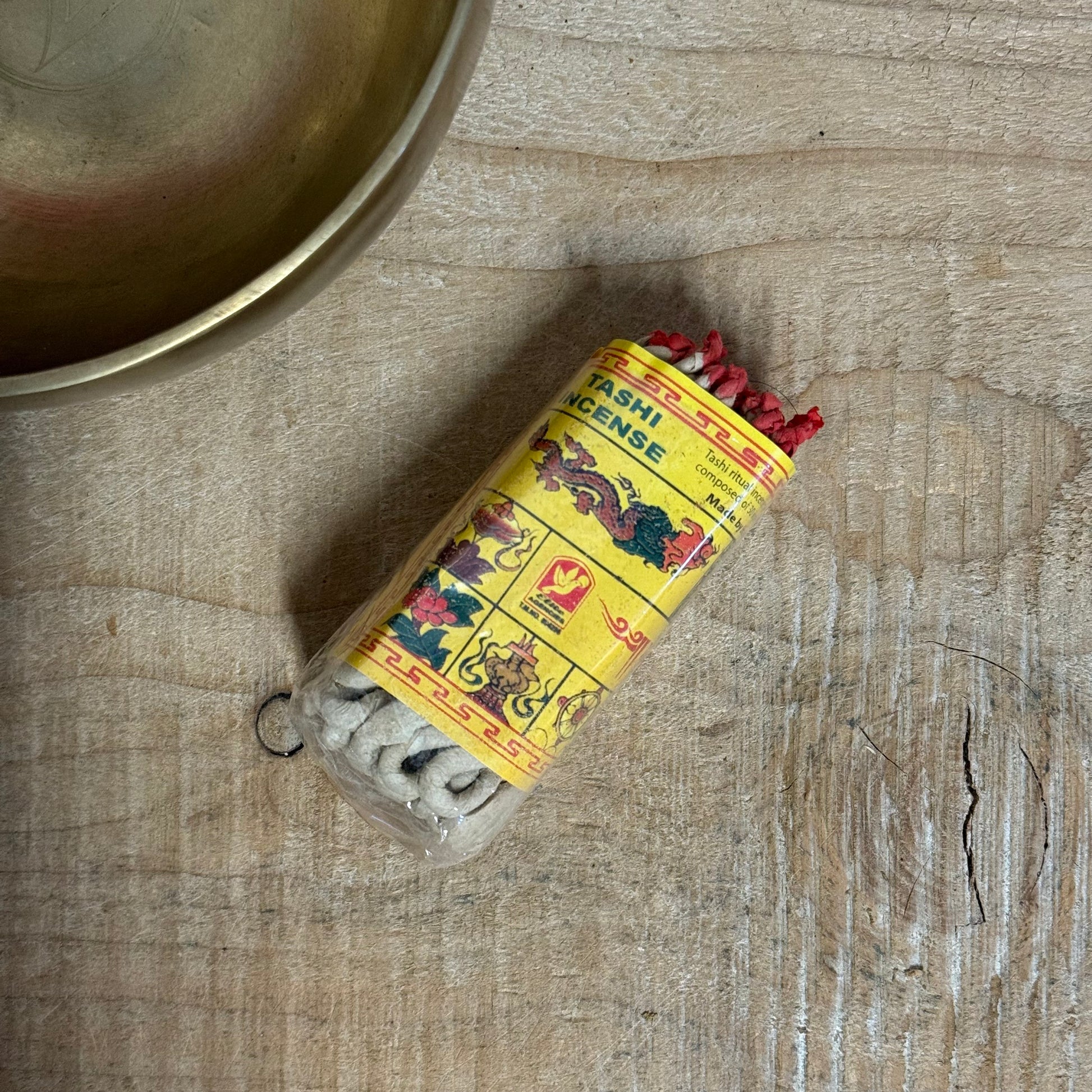 Let your breath meet the sacred. Tashi Buddha Rope Incense is a powerful expression of Himalayan spiritual tradition, handcrafted from 25 natural ingredients including red and white sandalwood, juniper, myrrh, cedarwood, frankincense, and the rare blessing of saffron and nagi.