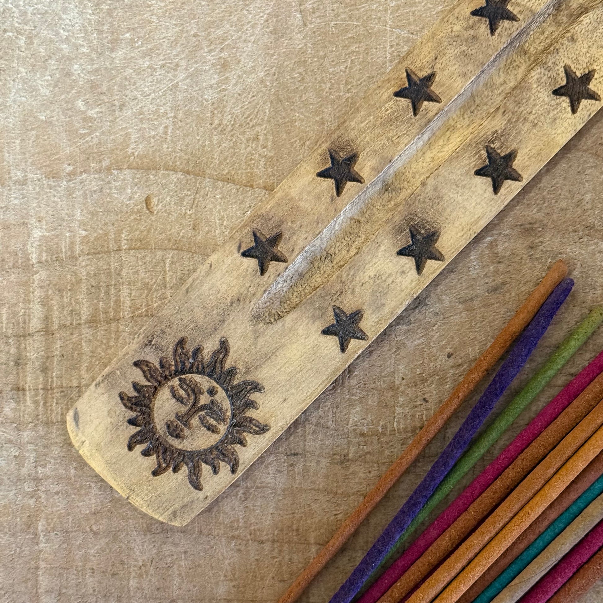 Natural mango wood incense ashcatcher with hand carved sun design 26cm