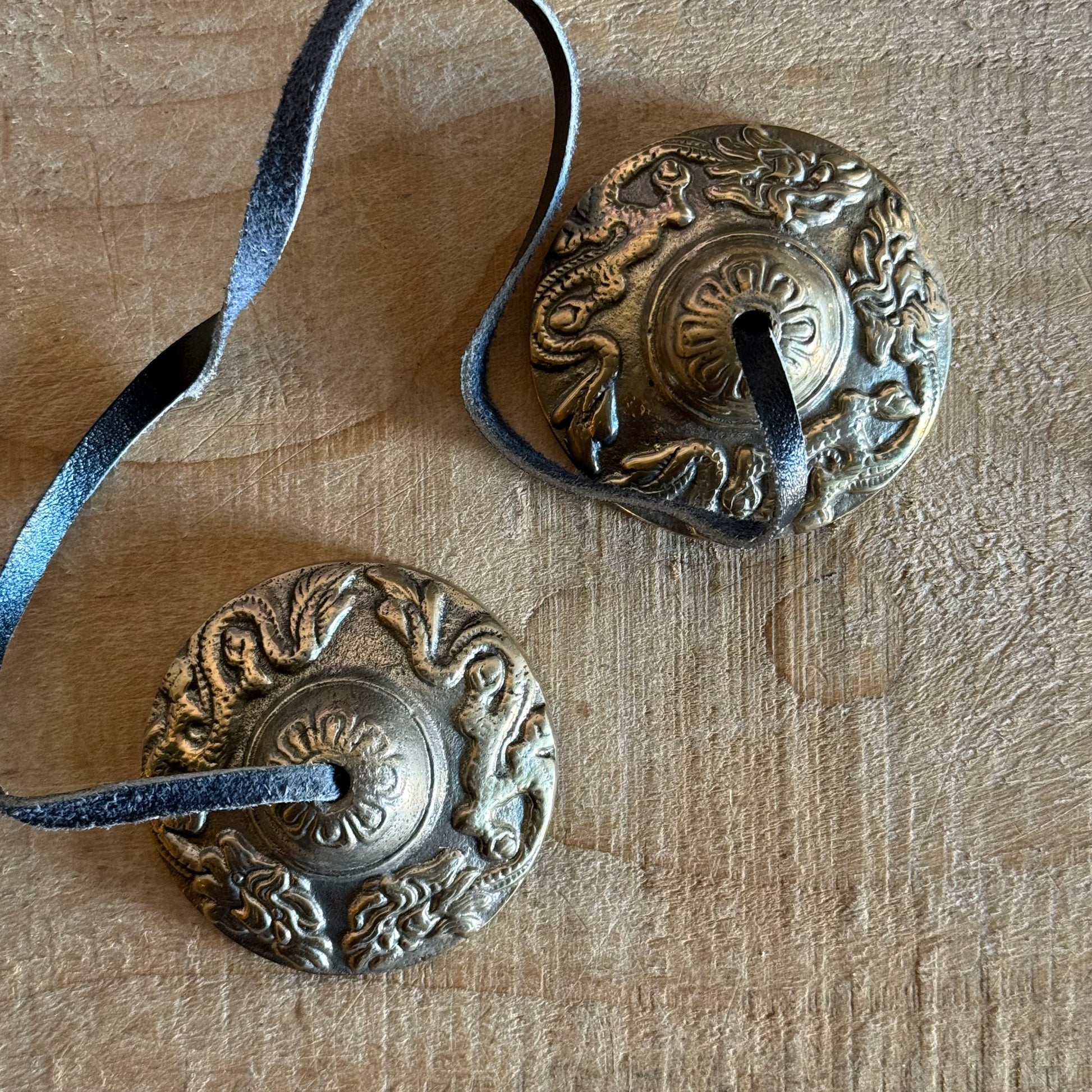 Boxed Naga Tingsha cymbals for meditation and prayer. Handcrafted in Nepal, embossed with sacred Naga or Dragon, perfect for altars and rituals.