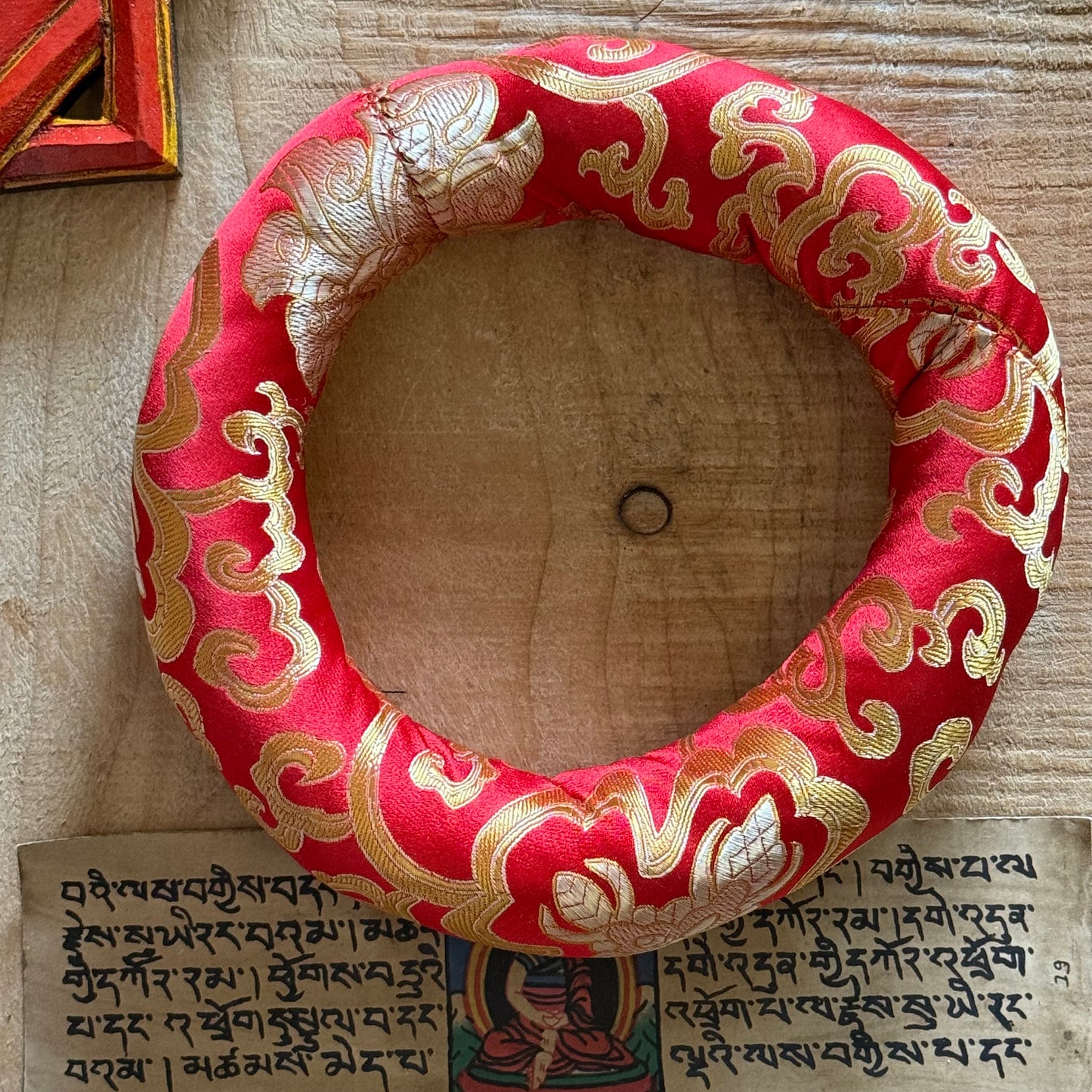 20cm Singing Bowl Cushion – Brocade Ring for Smaller Bowls

Elegant 20cm doughnut cushion cradles singing bowls in style. Ideal for healers & spiritual practice. Fits small to medium bowls. Shop at Buddha-Buddha.com.