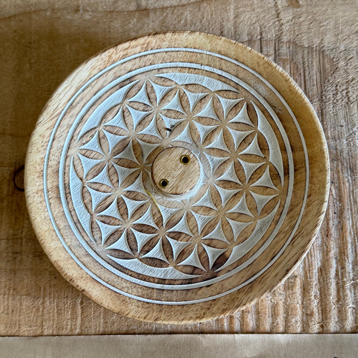 Invite harmony and sacred stillness into your space with this beautifully hand-carved Flower of Life Incense Burner, crafted from sustainable mango wood. The intricate Flower of Life design is more than just decoration — it is a sacred geometry symbol that reflects the interconnectedness of all life.