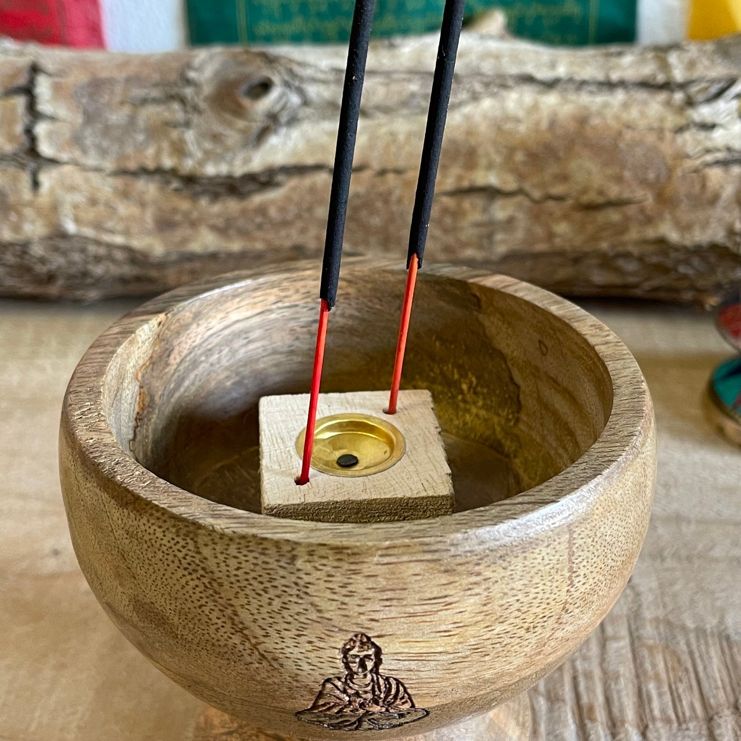 This incense holder is a compact yet intricate piece, measuring 11 cm across and standing 10 cm tall. Its dual-purpose design accommodates both incense sticks and cones, making it versatile for different types of incense rituals. The bowl-shaped holder features a serene Buddha symbol etched with precision on the inside surface, creating a focal point that enhances its spiritual ambiance. The Buddha engraving adds an element of tranquility, inviting a reflective, meditative quality to the space. Ideal for al