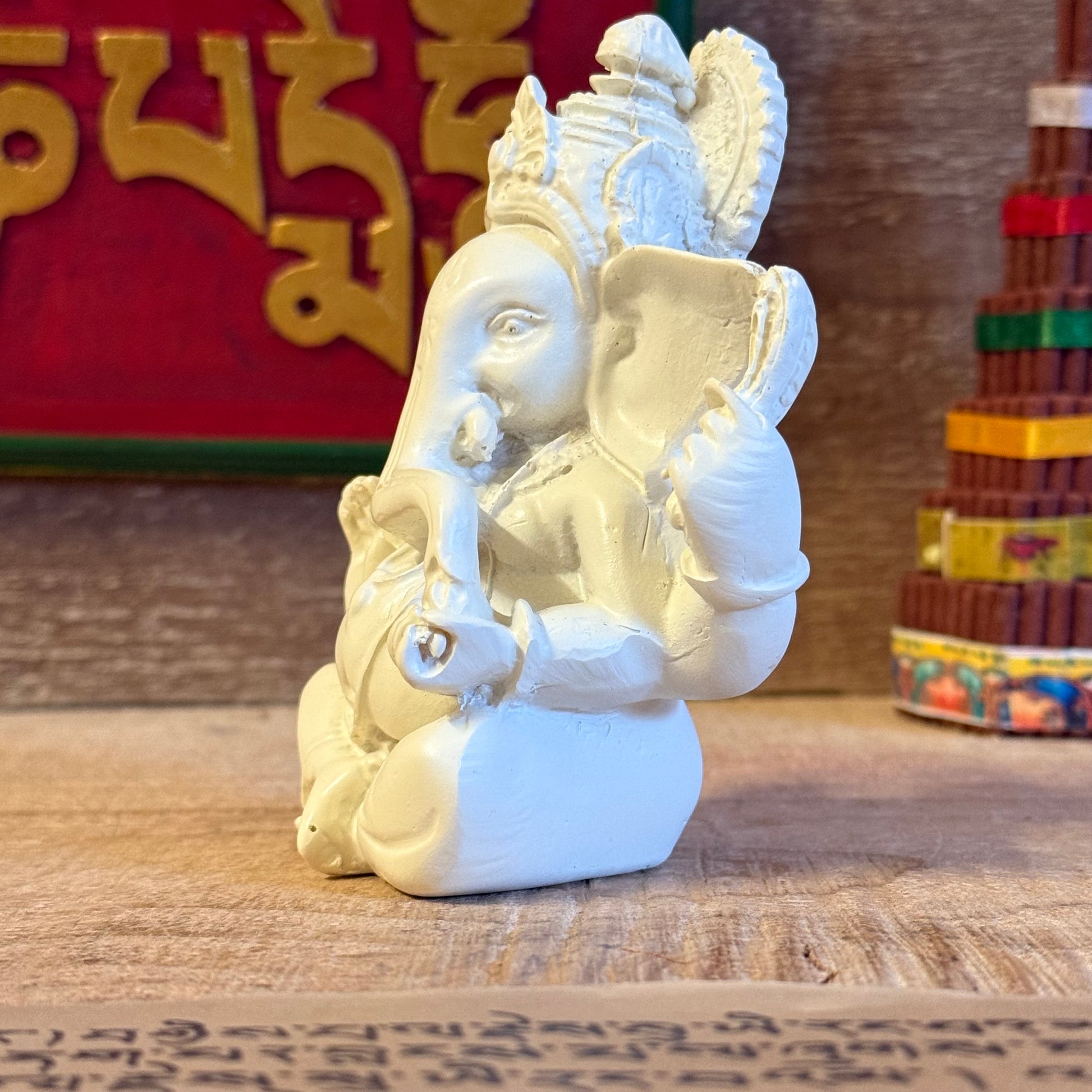 Invite blessings and good fortune into your home with this beautiful statue of Lord Ganesh, the revered elephant-headed god of wisdom, success, and prosperity. Handcrafted from durable poly resin and standing approximately 11cm tall, this piece captures Ganesh’s serene expression and four symbolic arms, each representing divine power and protection.