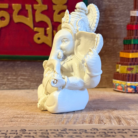 Invite blessings and good fortune into your home with this beautiful statue of Lord Ganesh, the revered elephant-headed god of wisdom, success, and prosperity. Handcrafted from durable poly resin and standing approximately 11cm tall, this piece captures Ganesh’s serene expression and four symbolic arms, each representing divine power and protection.