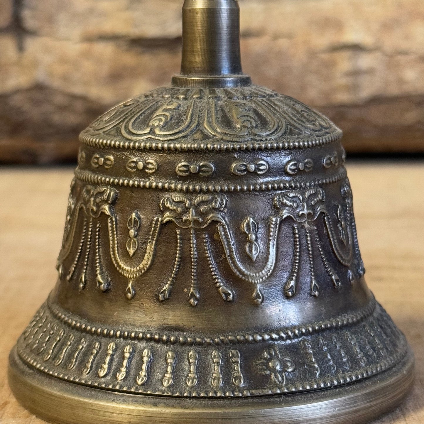 Discover the intricately engraved Kirtimukha Bell and Dorje Set, a primary ritual tool in Tibetan Buddhism. Handcrafted in Nepal, this bronze and brass set symbolizes wisdom and compassion, perfect for rituals and meditation.