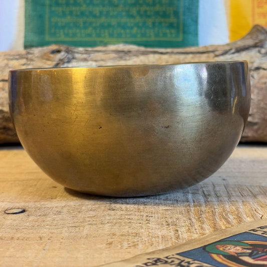 Unique Handmade Singing Bowl with Medicine Buddha Design

Elevate your meditation and healing practices with this one-of-a-kind Handmade Singing Bowl. Crafted with care in Nepal, this bowl combines copper, tin, and 8 noble metals, creating a harmonious blend of beauty and sound.

Material: Copper, tin, and a unique mix of 8 noble metals for exceptional sound quality.
Design: Features a finely engraved Medicine Buddha at the base, symbolizing healing and wisdom.
Dimensions: 14 cm in diameter, offering a comp