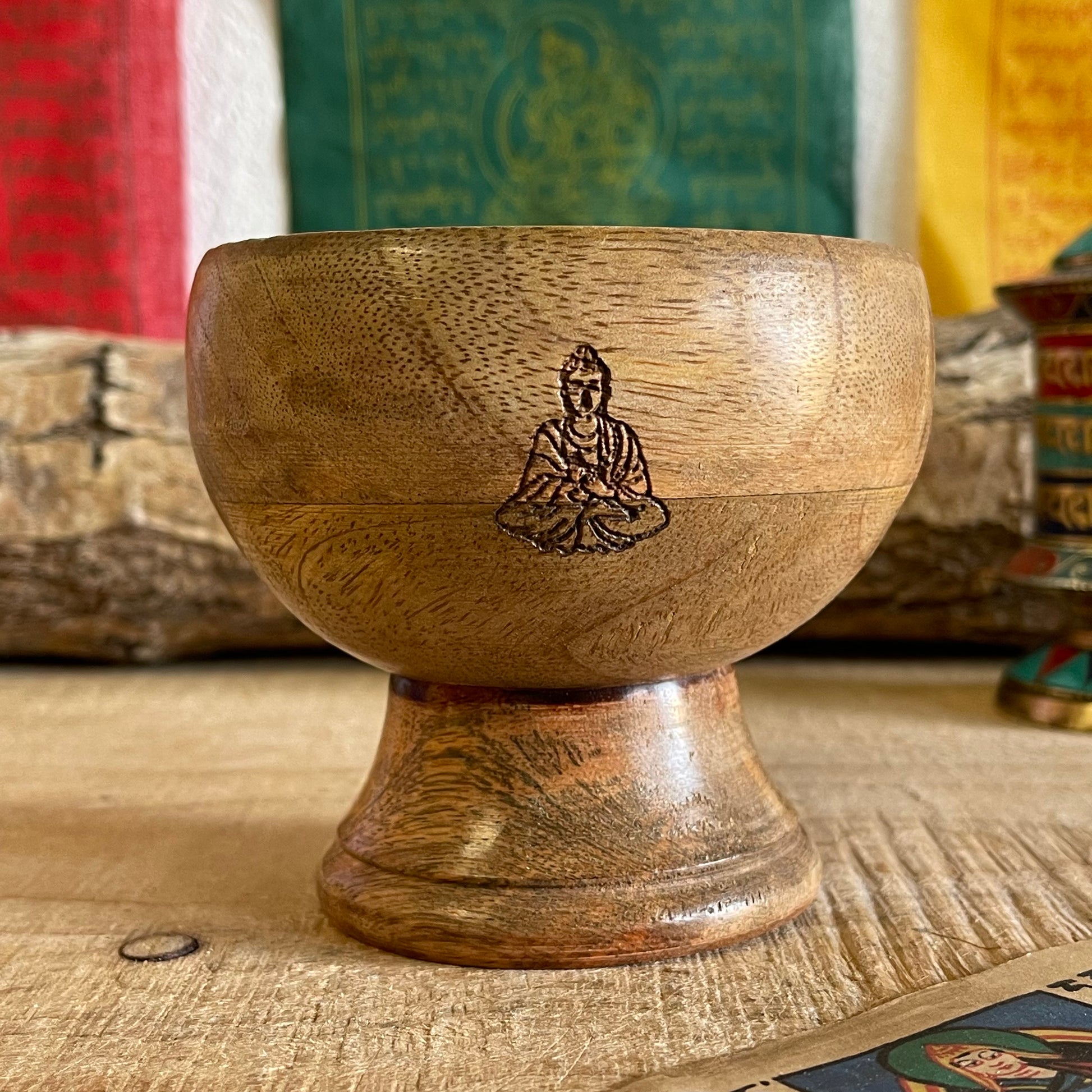 This incense holder is a compact yet intricate piece, measuring 11 cm across and standing 10 cm tall. Its dual-purpose design accommodates both incense sticks and cones, making it versatile for different types of incense rituals. The bowl-shaped holder features a serene Buddha symbol etched with precision on the inside surface, creating a focal point that enhances its spiritual ambiance. The Buddha engraving adds an element of tranquility, inviting a reflective, meditative quality to the space. Ideal for al