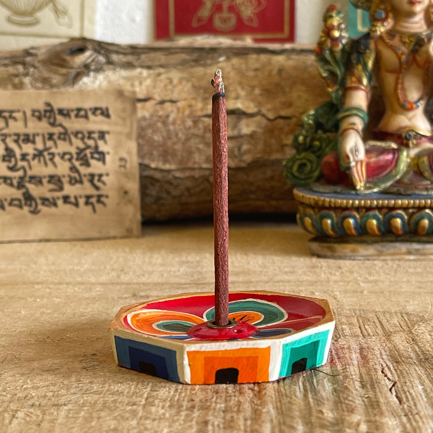 A beautiful Hand painted Tibetan Incense stick holder , Hand painted and ethically sourced this incense Holder is Perfect for the Larger Tibetan Incense it also has 4 small holes for Indian sticks.