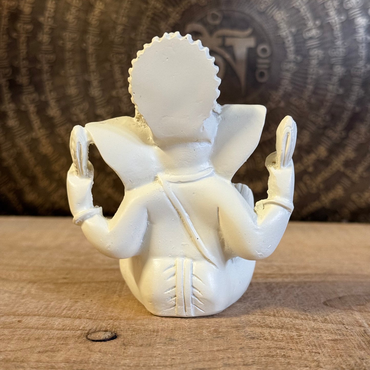 Bring luck and wisdom home with this 11cm Ganesh Statue. The four-armed elephant god symbolizes prosperity, protection, and spiritual success.