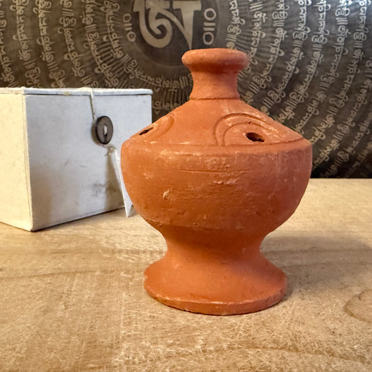 Handmade Bhaktapur pottery incense stick holder from Nepal. Fair trade clay burner for incense sticks or dhoop, ideal for meditation and ritual.