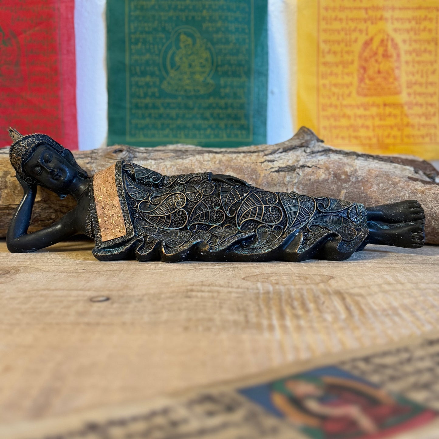 Capture the serene elegance of Buddhist artistry with this exquisite Thai-style reclining Buddha statue. Measuring 36 x 9 x 11 cm and crafted from durable poly resin, this piece combines traditional design with a timeless vintage aesthetic.