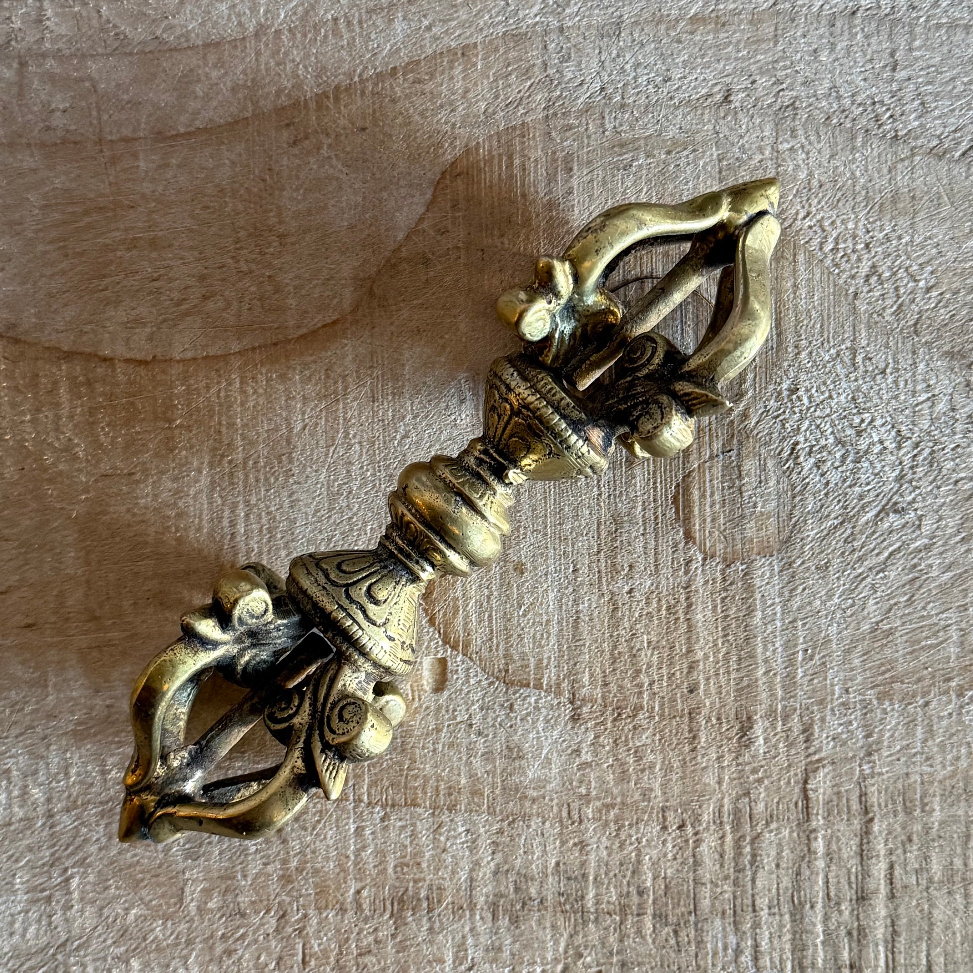 Kirtimukha Dorje vajra ritual object used in Tibetan Buddhism. Symbol of compassion, protection, and skillful action for altar or ceremony.