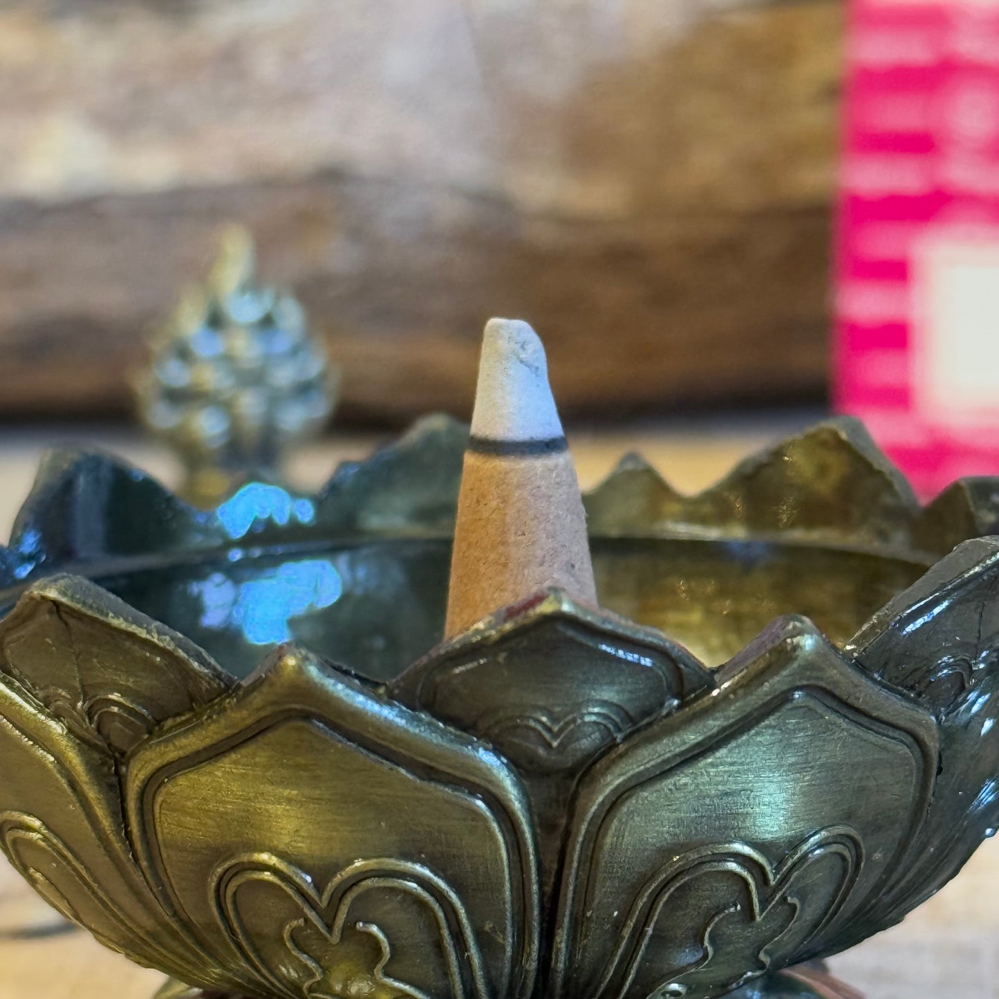 Enhance your home’s ambiance with this beautiful brass cone holder, thoughtfully designed in the shape of a lotus flower. Whether used for burning incense cones or as a charming decorative piece, this holder is both functional and elegant.

Key Features:
Elegant Lotus Design: The intricate lotus flower shape symbolizes purity and serenity, making it a meaningful addition to any space.
Majestic Smoke Display: Watch as the smoke gracefully curls through the lid’s opening, creating a soothing and captivating e