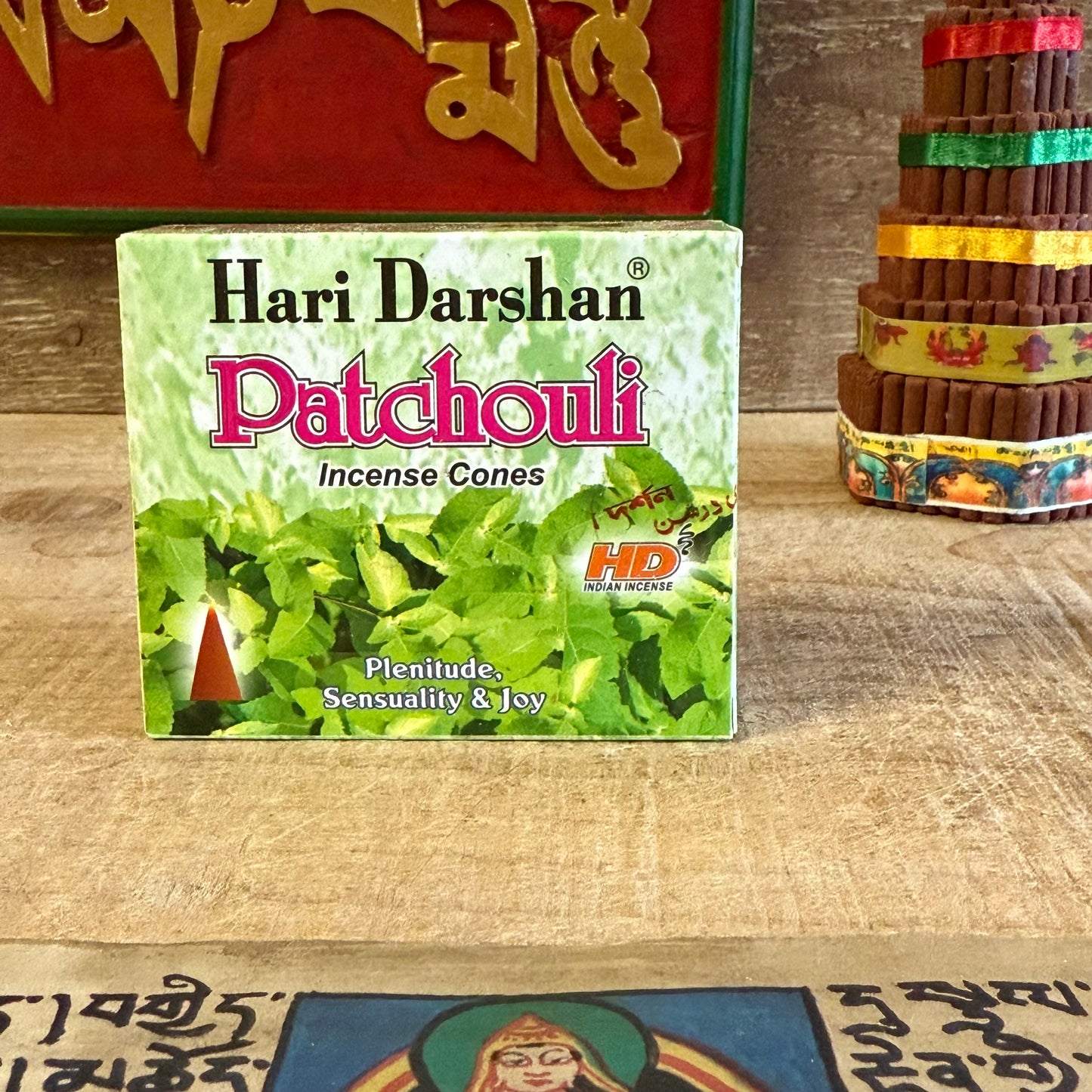 Ground your spirit and find inner stillness with Hari Darshan Patchouli Incense Cones, handcrafted in Bangalore, India, by traditional incense artisans. Made with the deep, earthy essence of patchouli, these cones release a mellow, grounding aroma that nurtures calm and emotional balance.