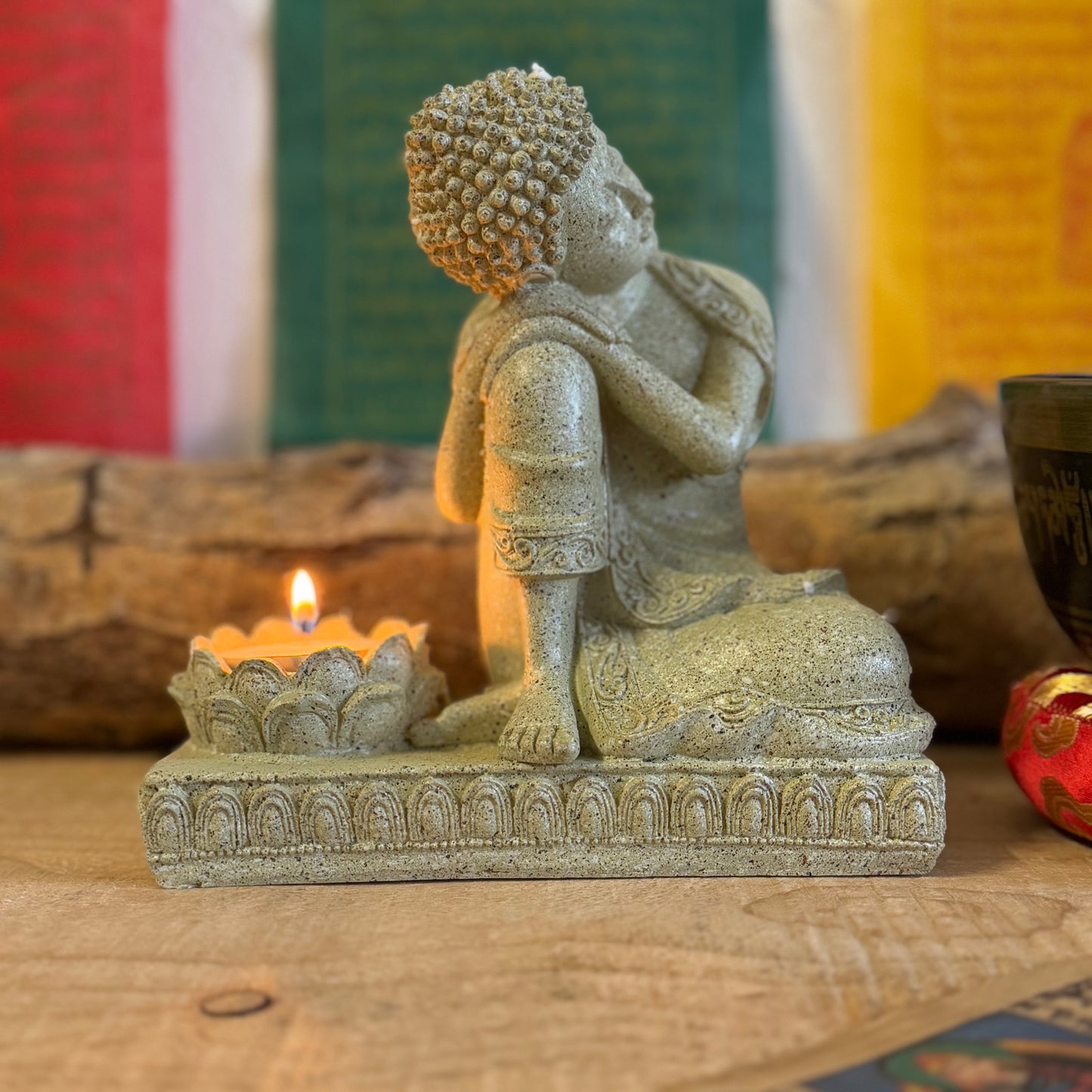 Elevate your space with this beautifully crafted Serene Relaxing Buddha Statue, perfect for creating a calming ambiance. Made from high-quality resin, the statue showcases intricate details, from the gentle expression of the Buddha to the delicately designed lotus flower that serves as a candle holder.