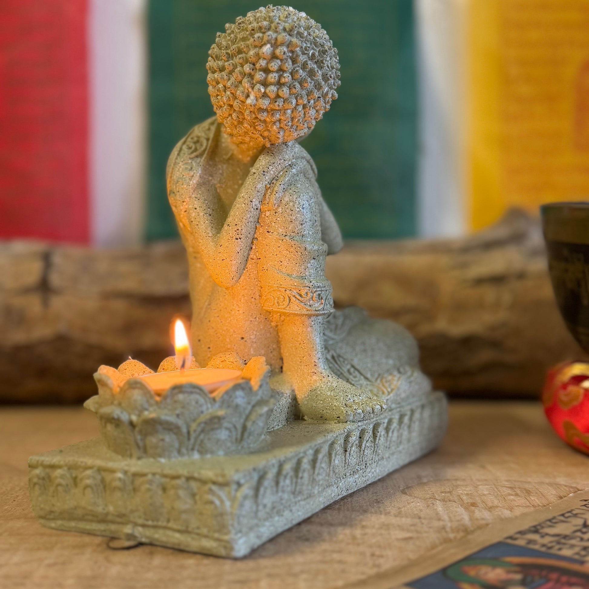 Elevate your space with this beautifully crafted Serene Relaxing Buddha Statue, perfect for creating a calming ambiance. Made from high-quality resin, the statue showcases intricate details, from the gentle expression of the Buddha to the delicately designed lotus flower that serves as a candle holder.