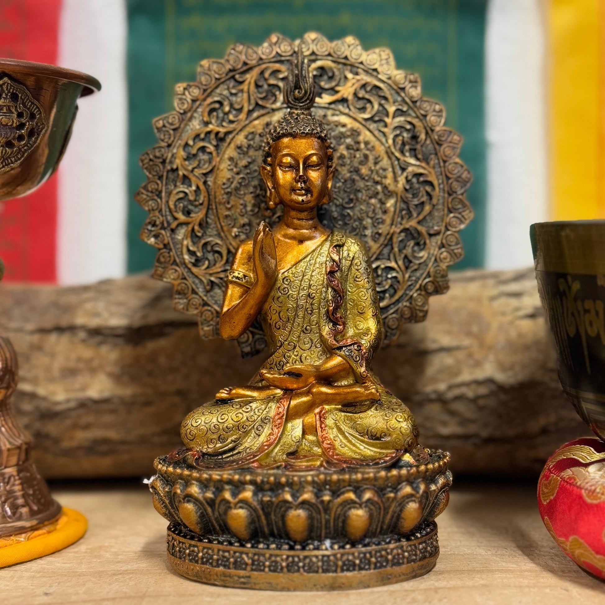 Buddha of Reassurance with Abhaya Mudra – 8cm x 18.5cm

Invite peace and protection into your home with this beautifully detailed Buddha of Reassurance statue, featuring the sacred Abhaya Mudra. Standing at approximately 18.5cm tall and 8cm wide, this exquisite statue captures the Buddha in a gesture of safety, peace, and reassurance. The Abhaya Mudra, where the right hand is raised with the palm facing outward, symbolizes protection, dispelling fear, and offering comfort during times of uncertainty.