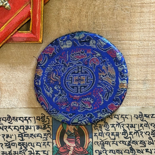 Brocade Singing Bowl Cushion | Handmade Support for Clear Sound

Enhance your practice with our brocade singing bowl cushion. Handmade in Nepal, it stabilizes your bowl for pure sound and adds beauty to your sacred space.

