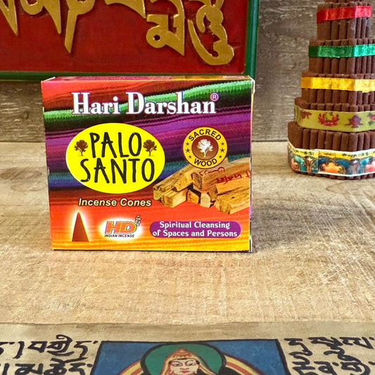 Cleanse your space and elevate your spirit with Hari Darshan Palo Santo Incense Cones, handcrafted in Bangalore, India, by expert incense makers devoted to purity and tradition. Infused with the mystical essence of Palo Santo (Holy Wood), these cones release a gentle, woody, citrus-sweet fragrance that purifies energy and restores natural balance.

For centuries, Palo Santo has been revered for its power to clear negativity, uplift the spirit, and invite peace. As each cone burns, sacred smoke rises—calming