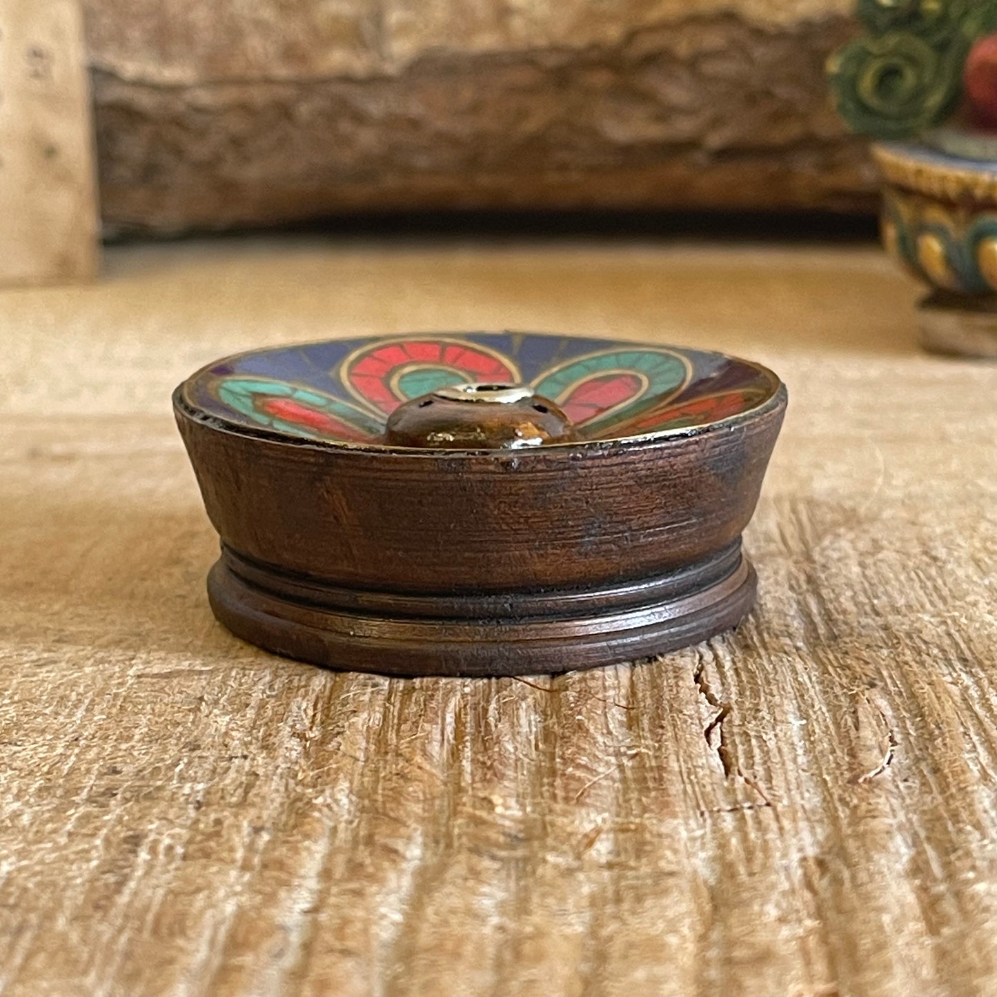 A beautiful Hand painted Tibetan Incense stick holder , Hand painted and ethically sourced this incense Holder is Perfect for the Larger Tibetan Incense it also has 4 small holes for Indian sticks.