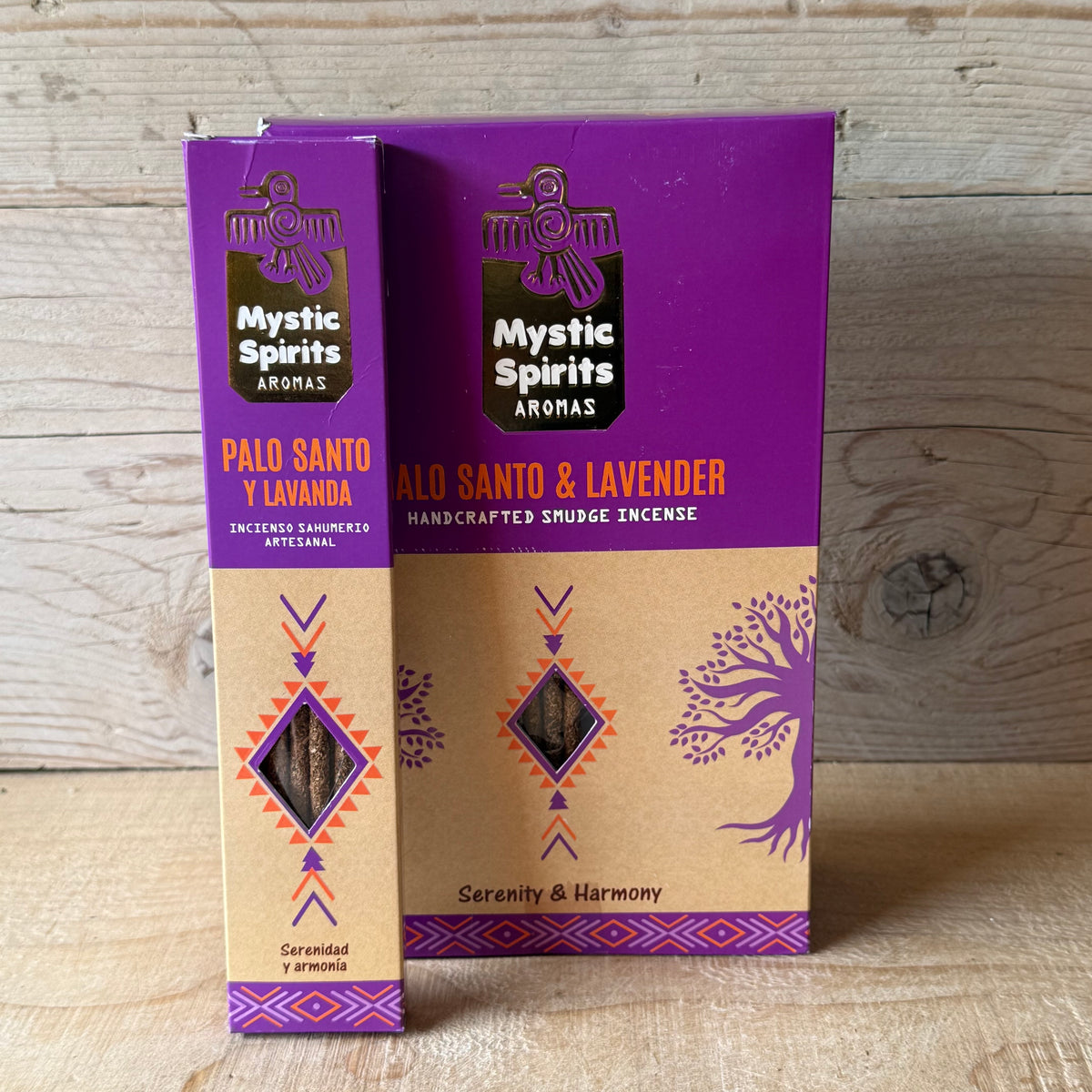 Two boxes of Mystic Spirits Aromas Palo Santo y Lavanda (Serenity & Harmony) handcrafted snudge incense, standing upright on a light wood surface against a light wood plank background.
