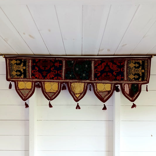 Handmade Indian Door Toran – Vintage Fabric Wall Hanging

Add color and culture to your home with this handmade Indian Door Toran. Crafted from vintage saris & fabrics—each piece is one-of-a-kind.