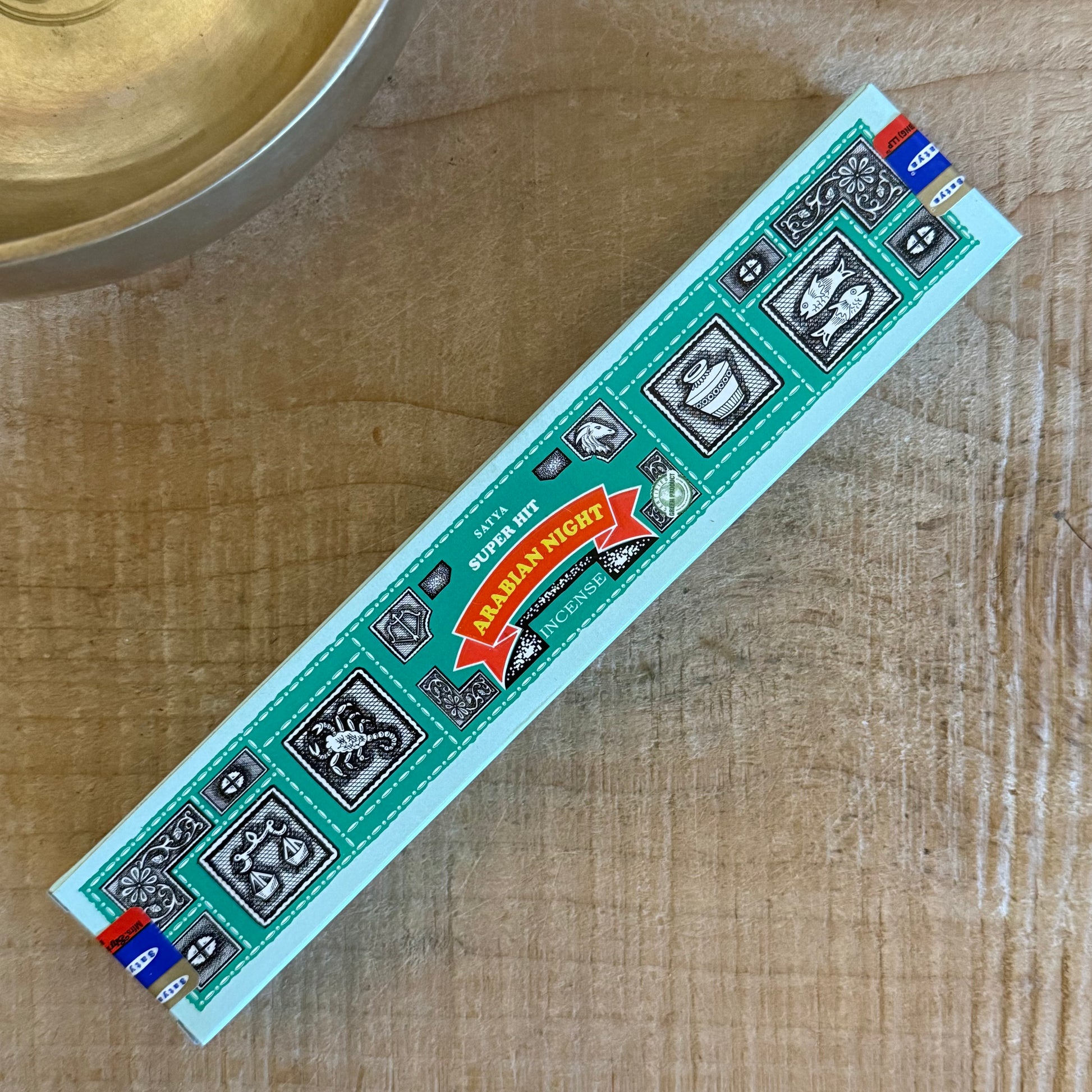 Experience the meditative aroma of Satya Super Hit Arabian Night Incense. Hand-rolled, sandalwood-based, perfect for rituals, cleansing, and inner peace.