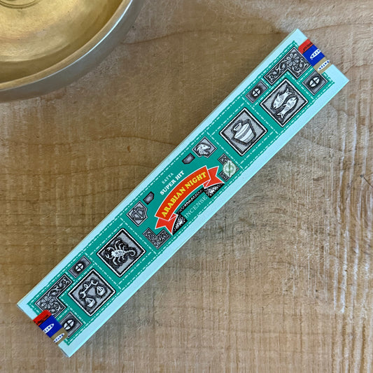 Experience the meditative aroma of Satya Super Hit Arabian Night Incense. Hand-rolled, sandalwood-based, perfect for rituals, cleansing, and inner peace.