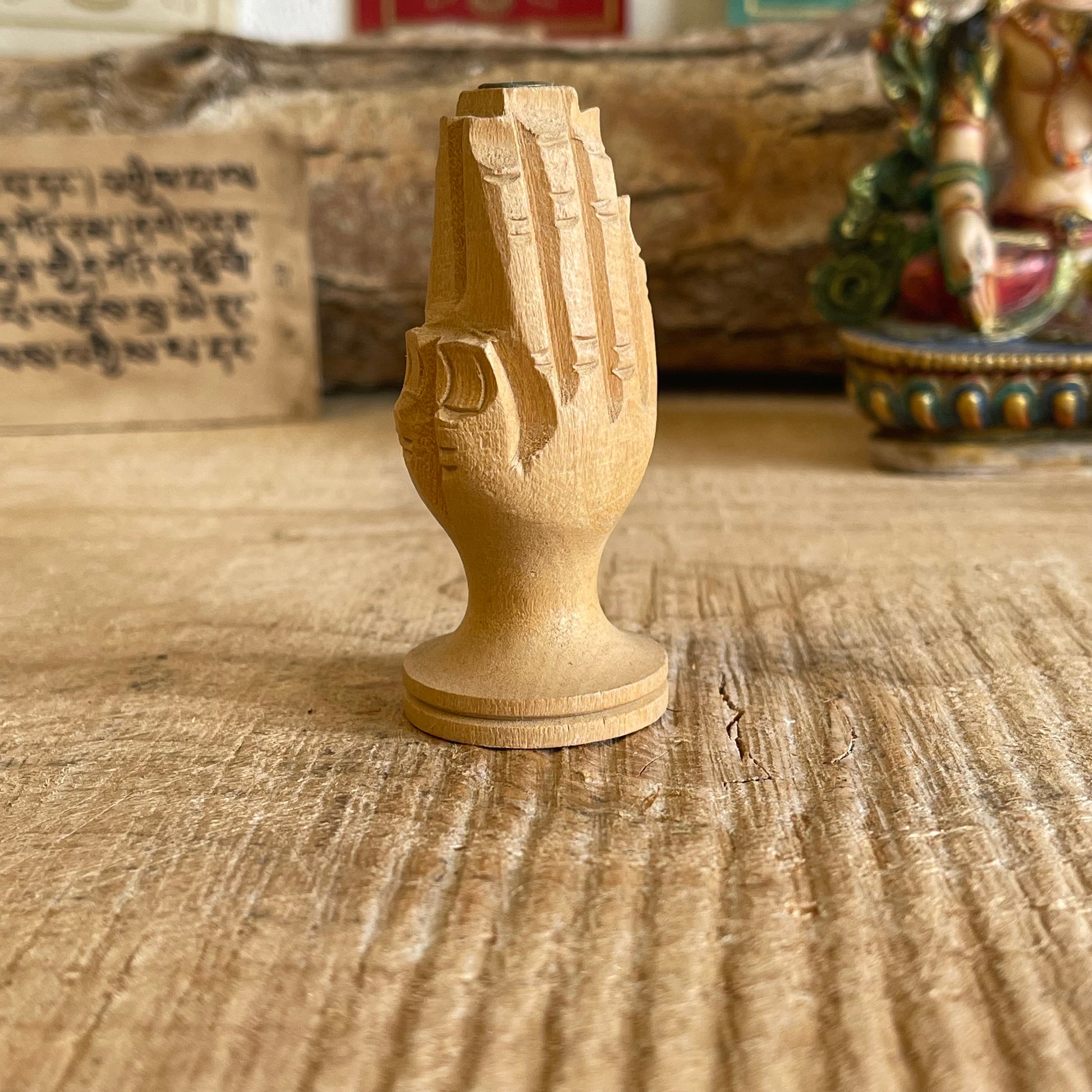 Hand carved piece of wood has been hand&nbsp;sculpted to look like hands joined together in prayer.  This intricately carved incense burner holds&nbsp;Tibetan Zimpu incense.  Approx.: 7cm High Origin: Nepal