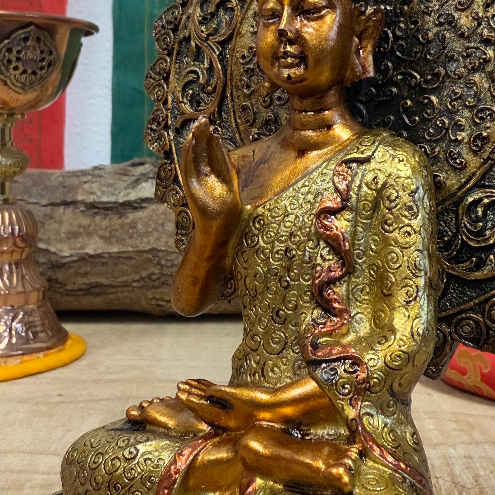 Buddha of Reassurance with Abhaya Mudra – 8cm x 18.5cm

Invite peace and protection into your home with this beautifully detailed Buddha of Reassurance statue, featuring the sacred Abhaya Mudra. Standing at approximately 18.5cm tall and 8cm wide, this exquisite statue captures the Buddha in a gesture of safety, peace, and reassurance. The Abhaya Mudra, where the right hand is raised with the palm facing outward, symbolizes protection, dispelling fear, and offering comfort during times of uncertainty.