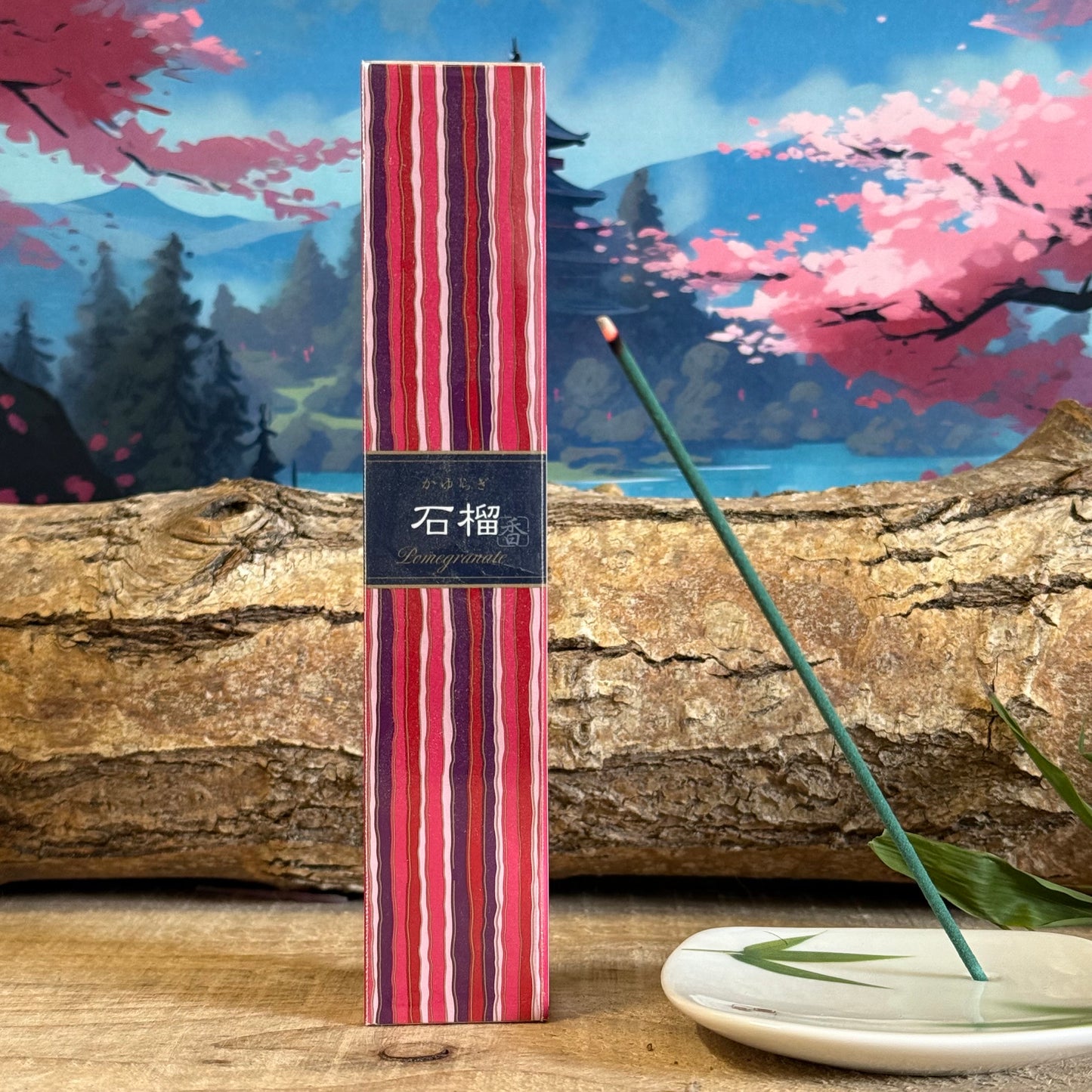 This unusually fruity incense certainly packs a punch, with its fresh and sour notes. The zing of pomegranate is reflected in its striking packaging design too, which feature bright stripes in shades of red and purple – a design that’s inspired by traditional Japanese kimono fabrics.&nbsp;

The 40 sticks of Kayuragi Pomegranate incense come in a Paulownia wood box, along with a small incense stick holder.

Number of Sticks in Box: 40
Burn Time Per Stick: Approximately 25 Minutes
Length of Sticks: Approximat