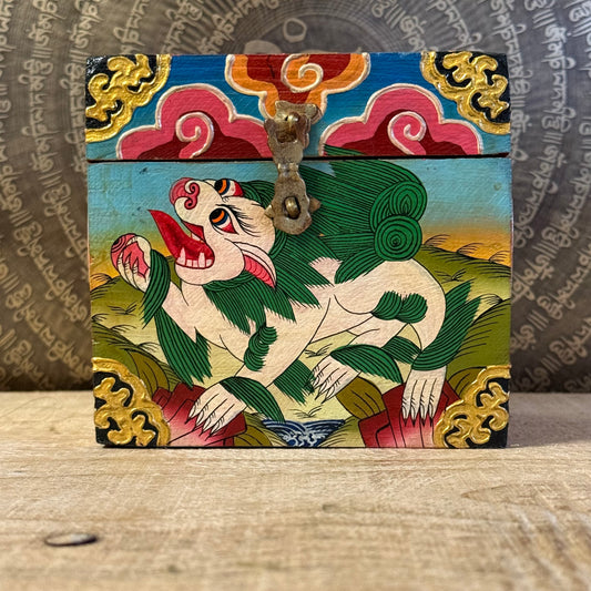 Hand-painted Tibetan square wooden box from Nepal, decorated with Buddhist symbols. Fairtrade, unique storage for jewellery or altar items.