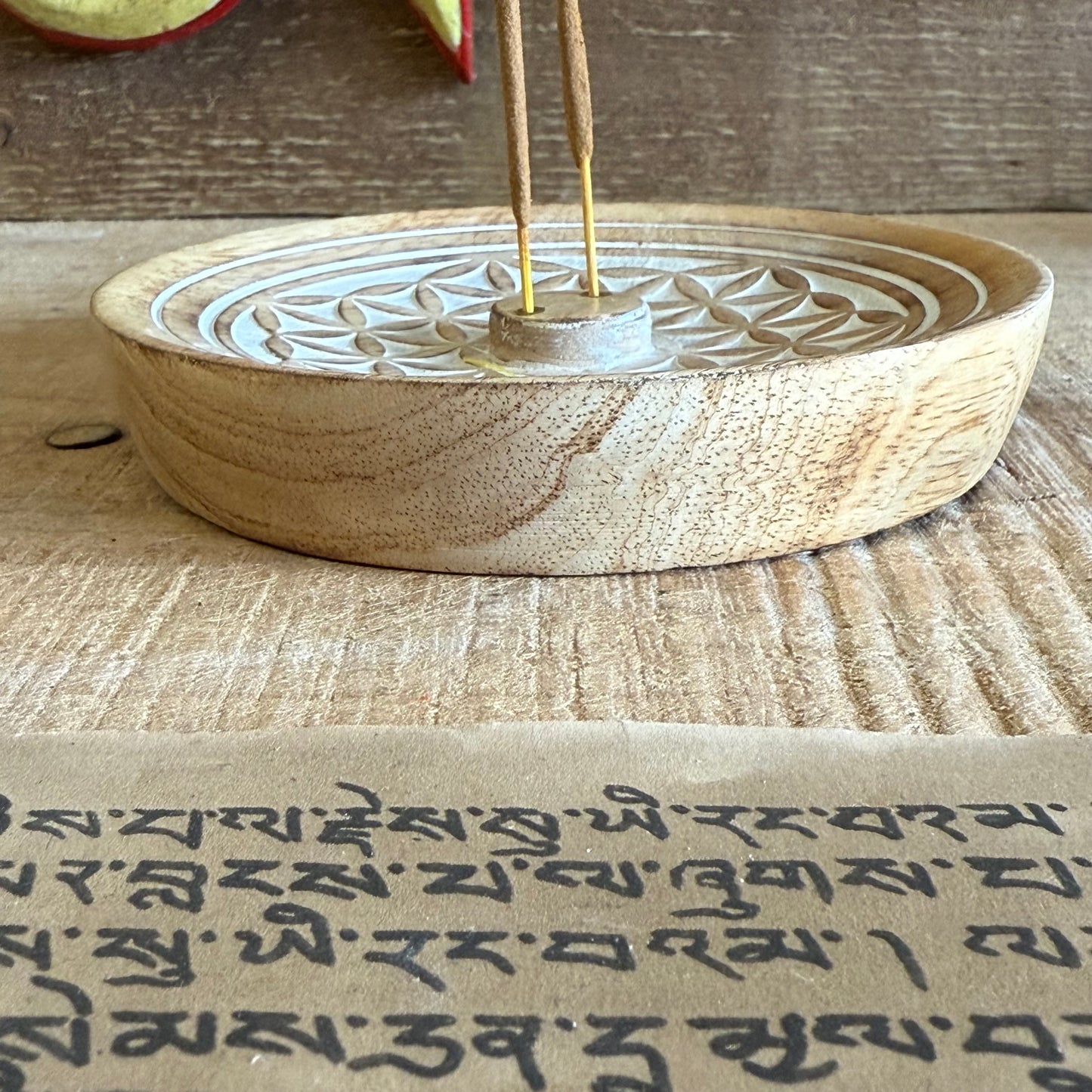 Invite harmony and sacred stillness into your space with this beautifully hand-carved Flower of Life Incense Burner, crafted from sustainable mango wood. The intricate Flower of Life design is more than just decoration — it is a sacred geometry symbol that reflects the interconnectedness of all life.