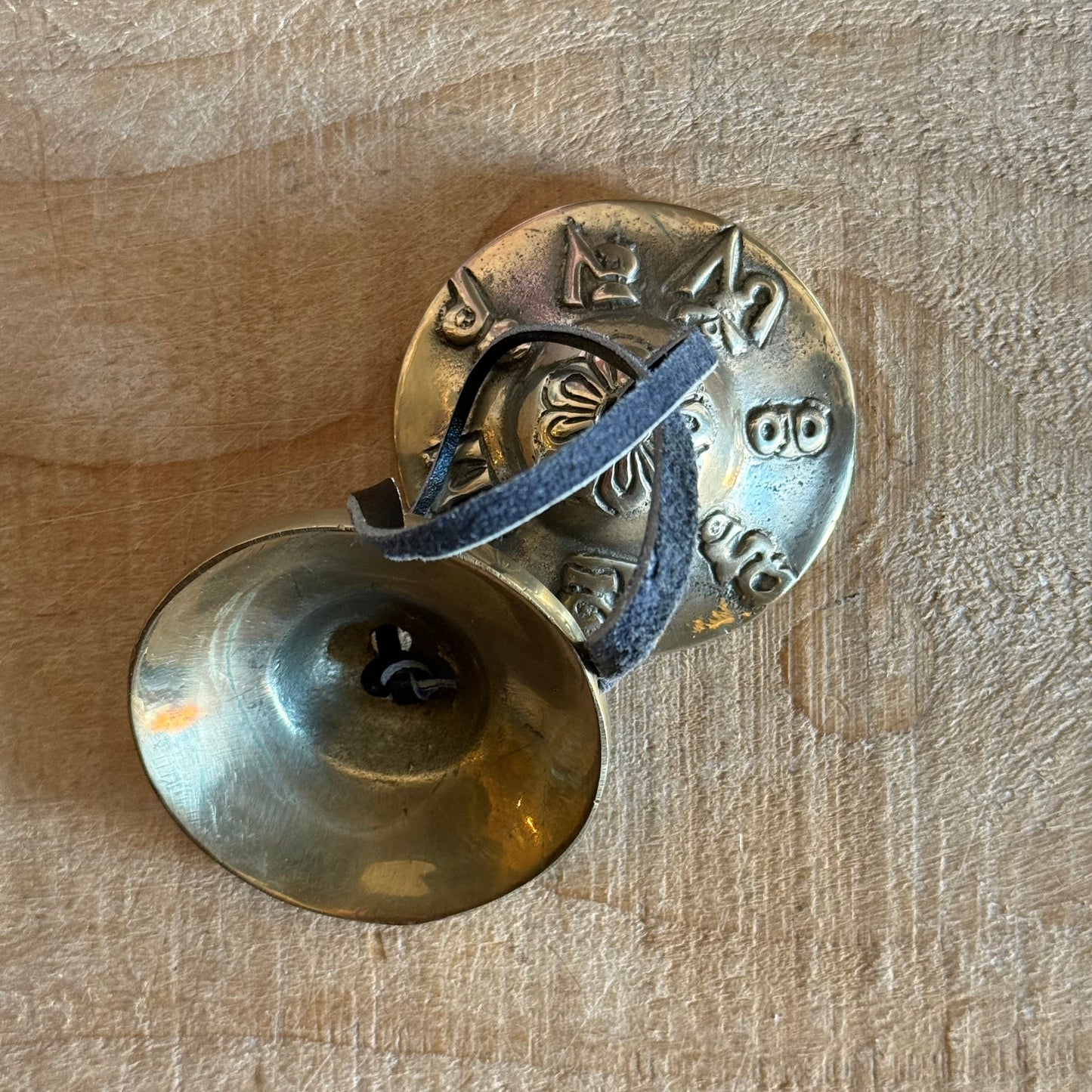 Om Mani Padme Hum Tingsha cymbals for meditation and rituals. Handmade in Nepal, engraved with sacred mantra, perfect for altars and spiritual practice.