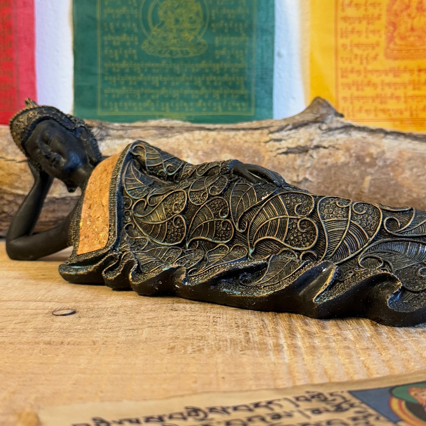 Capture the serene elegance of Buddhist artistry with this exquisite Thai-style reclining Buddha statue. Measuring 36 x 9 x 11 cm and crafted from durable poly resin, this piece combines traditional design with a timeless vintage aesthetic.