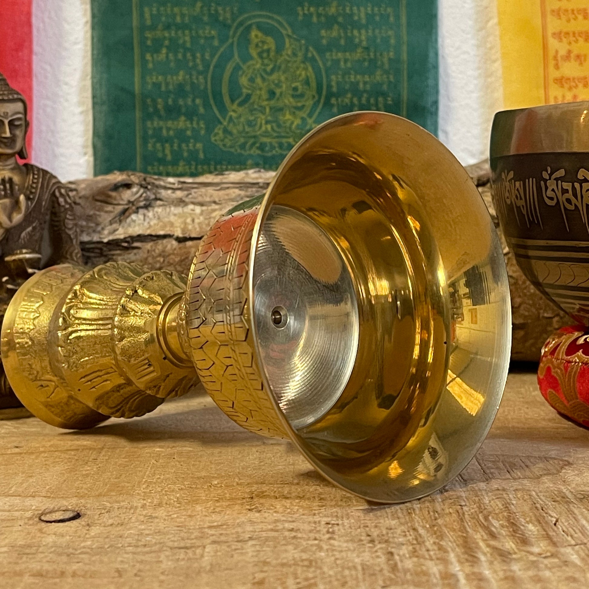 A traditional Tibetan Buddhist Butter lamp made from Brass.

Butter lamps are to be found in all Tibetan Buddhist temples and monasteries throughout the Himalayas. The lamps traditionally burn clarified yak butter, but now often use vegetable oil or vegetable ghee. Each morning Tibetan Buddhists offer butter lamps to represent the illumination of wisdom.