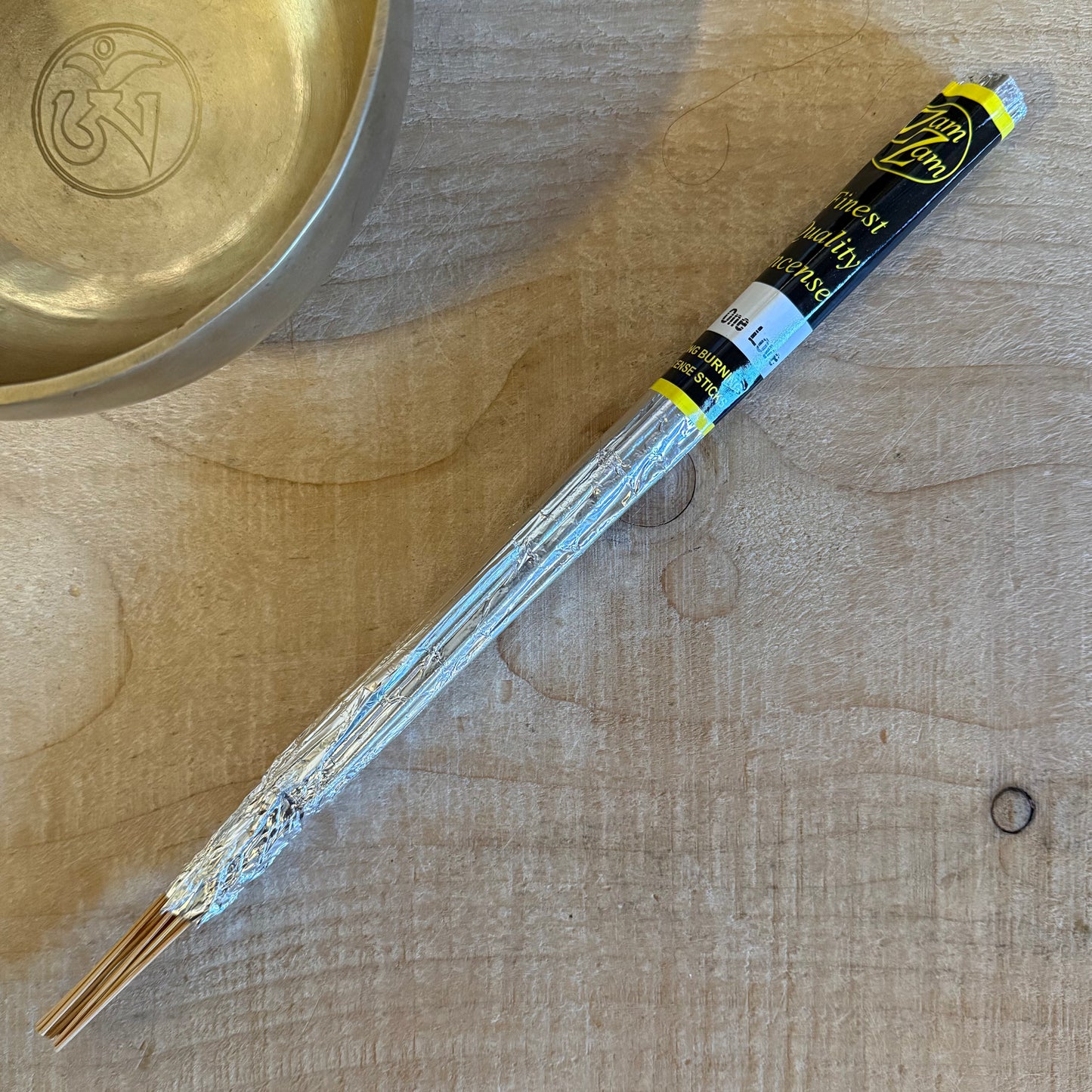 Zam Zam One Love incense sticks with a warm, uplifting aroma. Long burning hand rolled incense for meditation, rituals, and relaxed spaces.