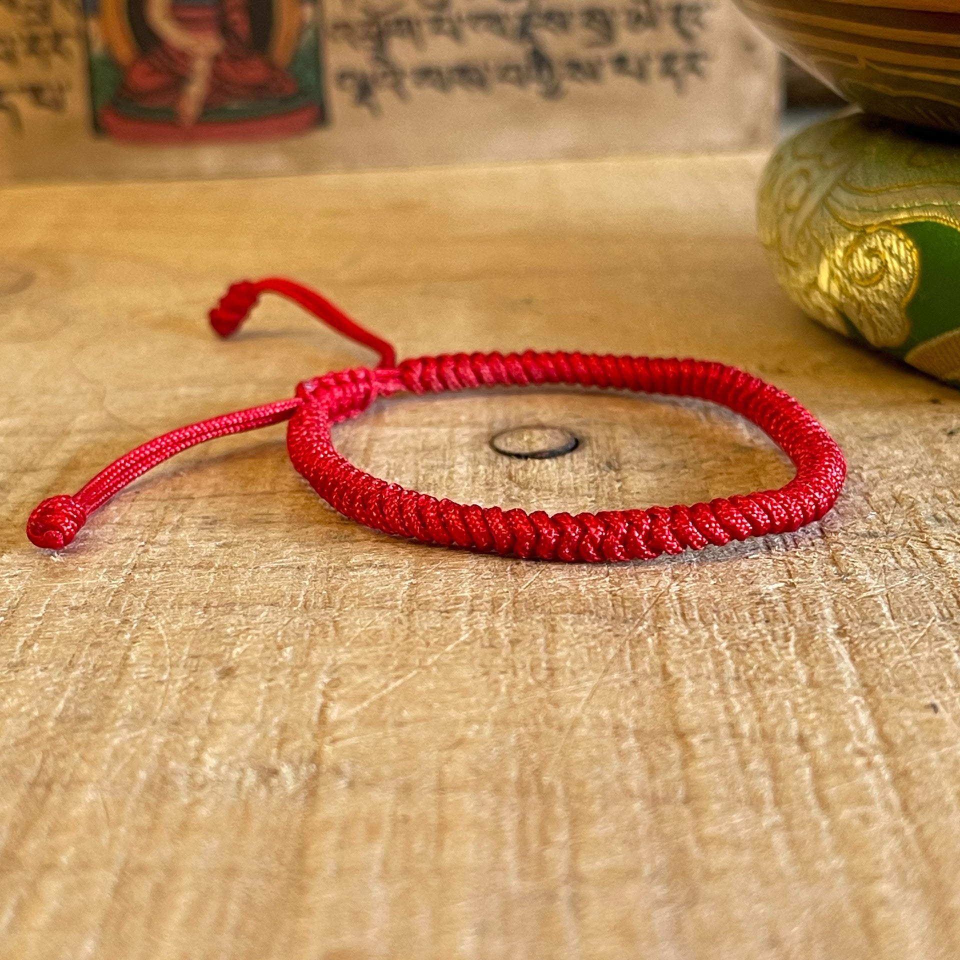Lucky Tibetan Red Cord bracelet with Nepalese Pouch – The Buddha