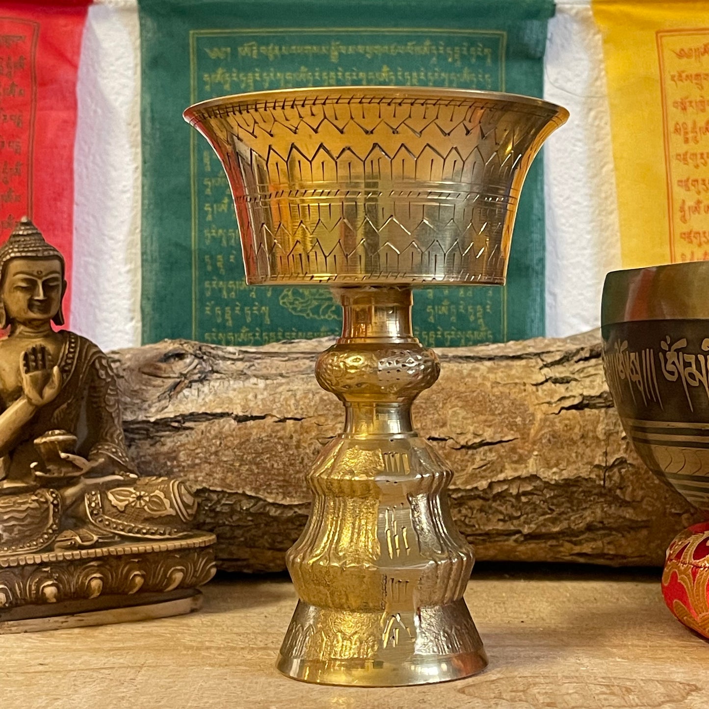 A traditional Tibetan Buddhist Butter lamp made from Brass.

Butter lamps are to be found in all Tibetan Buddhist temples and monasteries throughout the Himalayas. The lamps traditionally burn clarified yak butter, but now often use vegetable oil or vegetable ghee. Each morning Tibetan Buddhists offer butter lamps to represent the illumination of wisdom.