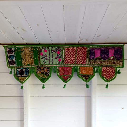 Handmade Indian Door Toran – Vintage Fabric Wall Hanging

Add color and culture to your home with this handmade Indian Door Toran. Crafted from vintage saris & fabrics—each piece is one-of-a-kind.