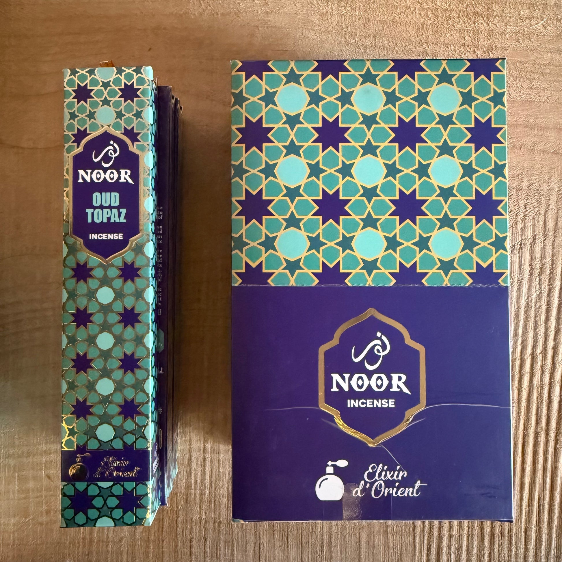 Discover Noor Oud Topaz Incense, a refined blend of oud, saffron, patchouli, and sandalwood with a warm, sophisticated Middle Eastern aroma.