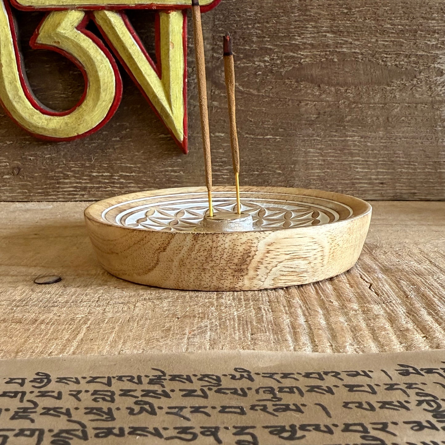 Invite harmony and sacred stillness into your space with this beautifully hand-carved Flower of Life Incense Burner, crafted from sustainable mango wood. The intricate Flower of Life design is more than just decoration — it is a sacred geometry symbol that reflects the interconnectedness of all life.