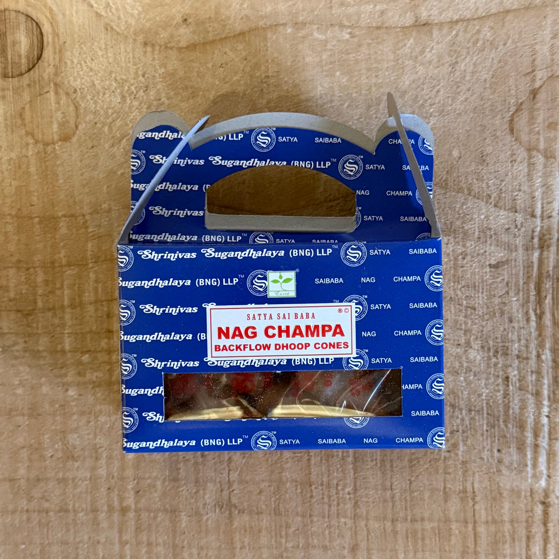 Satya Nag Champa Backflow Incense Cones creating cascading smoke for meditation and ritual
